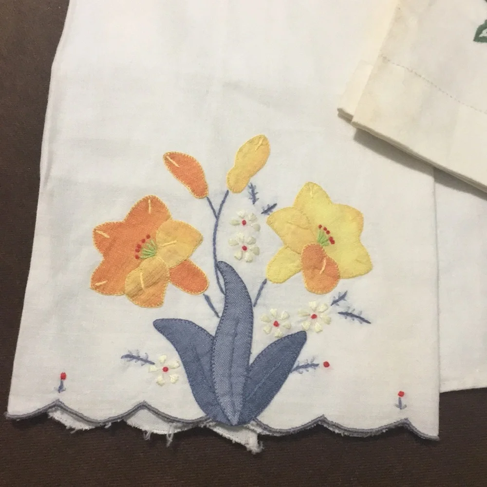 PEACH embroidered flowers tea towel. You this that particular one.